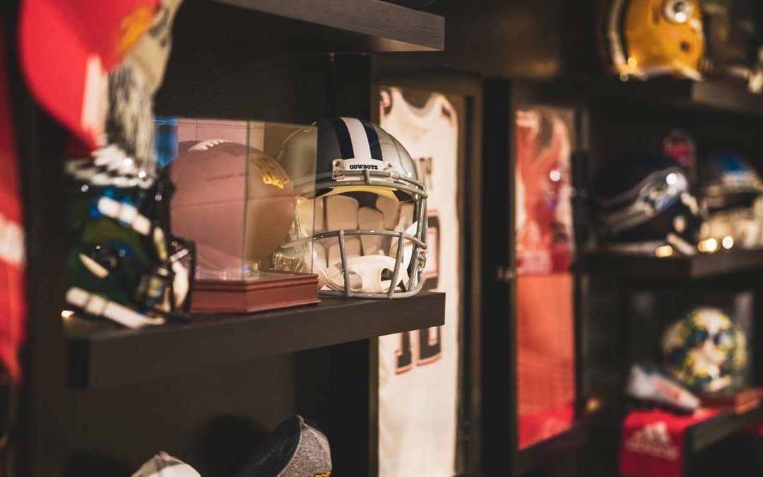 NFL Football Helmets on Shelves